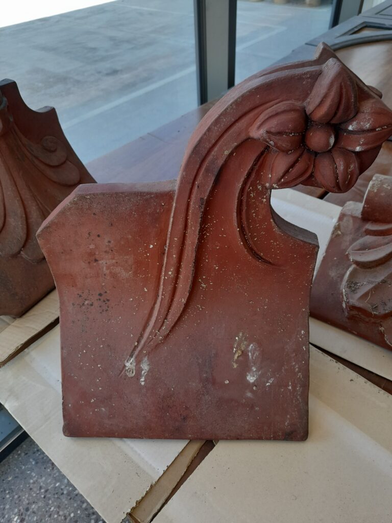A Reclaimed Red Flower Clay Roof Finial 75º Roofing and Salvage Depot