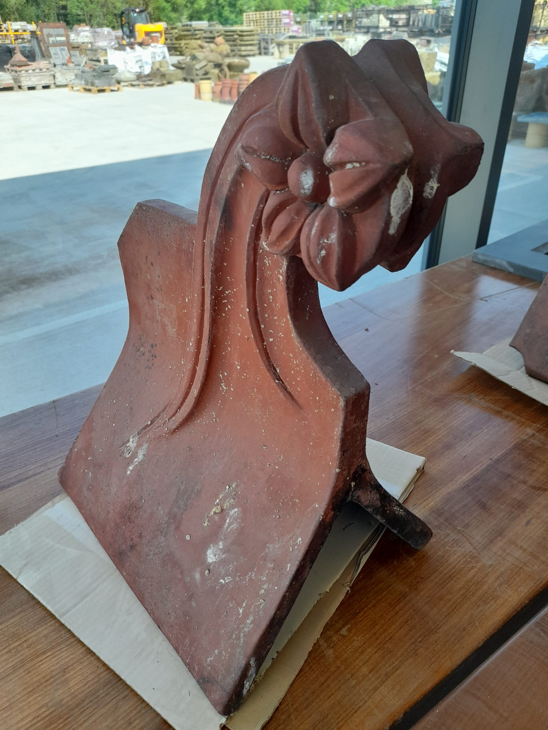 A Reclaimed Red Flower Clay Roof Finial 75º Roofing and Salvage Depot