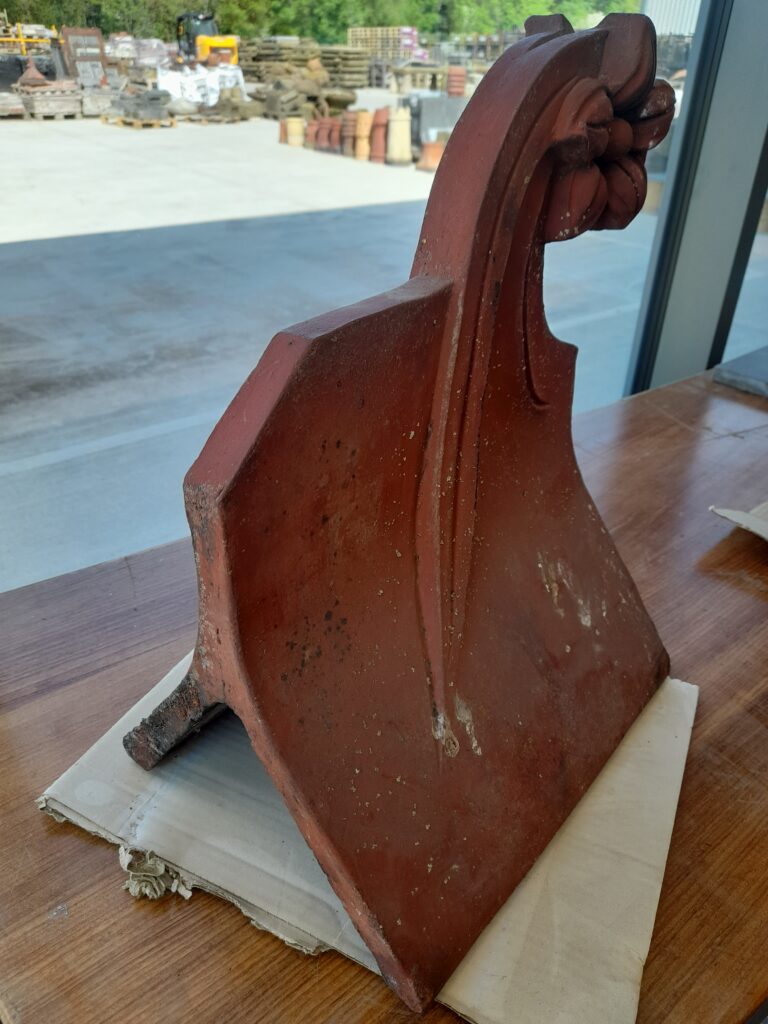 A Reclaimed Red Flower Clay Roof Finial 75º Roofing and Salvage Depot