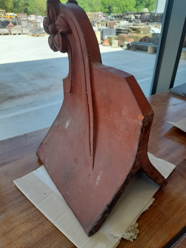 A Reclaimed Red Flower Clay Roof Finial 75º Roofing and Salvage Depot